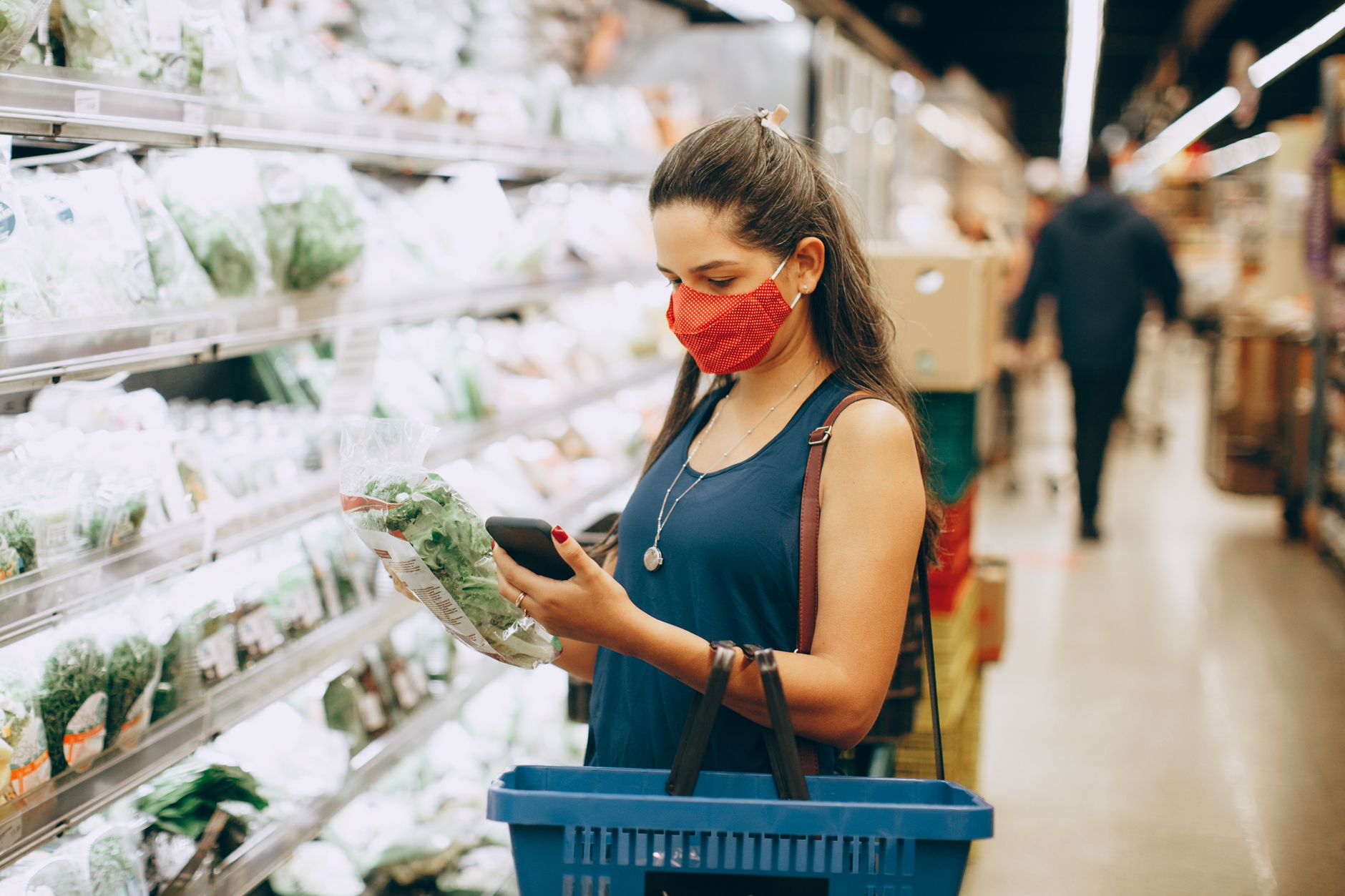 Discerning consumer looking closely at high quality physical products